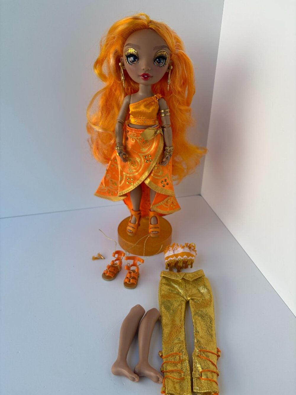 Rainbow High Meena Fleur Saffron Gold Fashion Doll Set with 2 Outfits